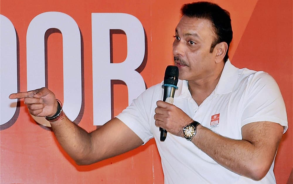 Former cricketer Ravi Shastri interacts with students at an event in Kolkata.