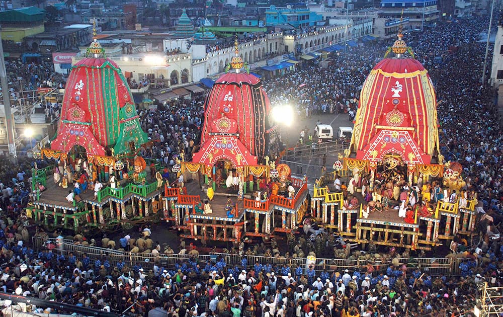 Devotees throng around chariots during the return of chariots event that marks the end of the nine-day chariot festival of Lord Jagannath in Puri on Tuesday. The three idols of Hindu god Jagannath, his brother Balabhadra and sister Subhadra are taken out in a grand procession in specially made chariots and are pulled by thousands of devotees during the festival. 