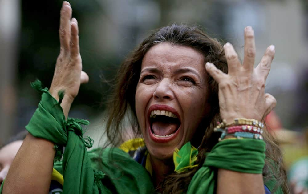 A Brazil soccer fan screams as Germany defeats her team 7-1 in a semifinal World Cup match as she watches the game on a live telecast in Belo Horizonte, Brazil.