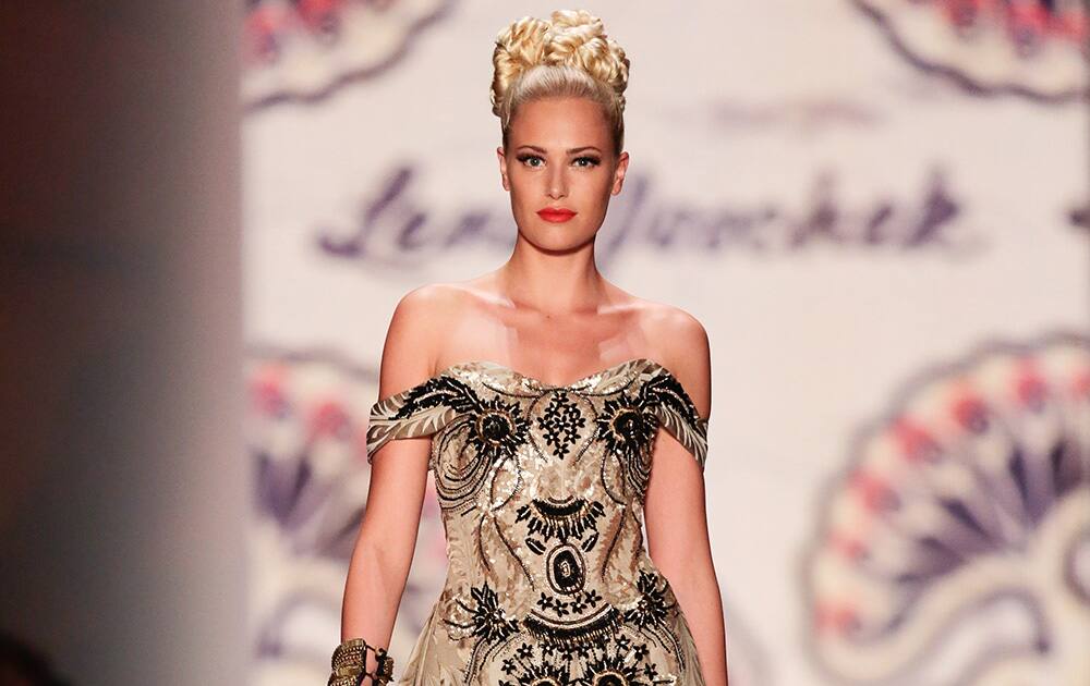 A model wears a creation of Austrian fashion designer Lena Hoschek`s Spring/Summer 2015 collection during the Mercedes Benz Fashion Week in Berlin.