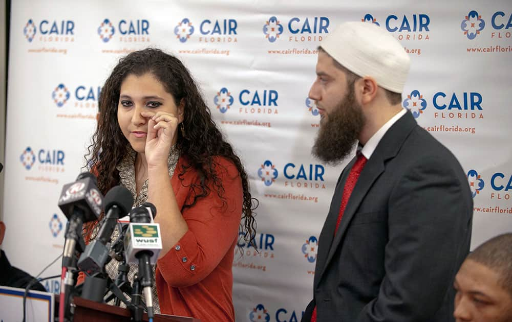 Sanah Abukhdeir, aunt of teen Tariq Abu Khdeir, wipes a tear as she speaks next to attorney Hassan Shibly during a press conference at the Council of American-Islamic Relations (CAIR) in Tampa, Fla.