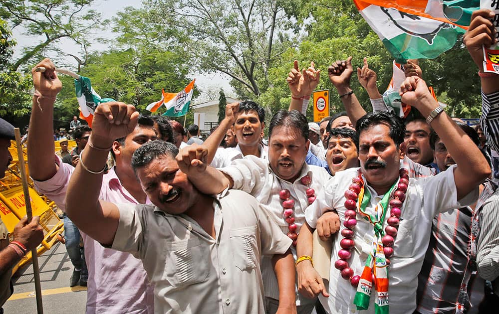 India’s main opposition Congress party workers shout slogans against the ruling Bharatiya Janata Party (BJP) during a protest in New Delhi.