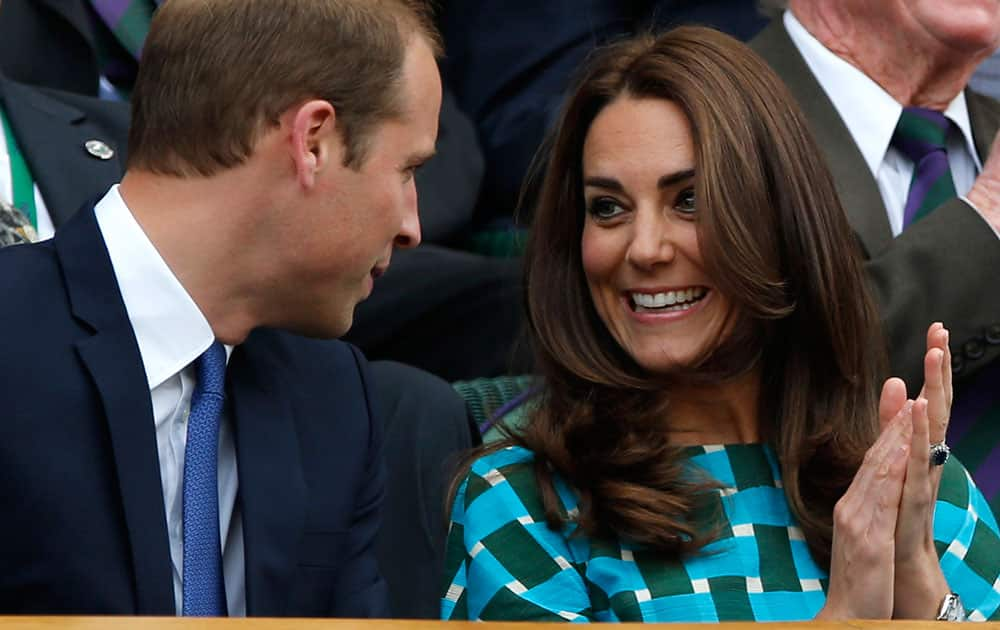 Britain`s Prince William and Kate, Duchess of Cambridge talk prior to the men`s singles final between Roger Federer of Switzerland and Novak Djokovic of Serbia on centre court at the All England Lawn Tennis Championships in Wimbledon.