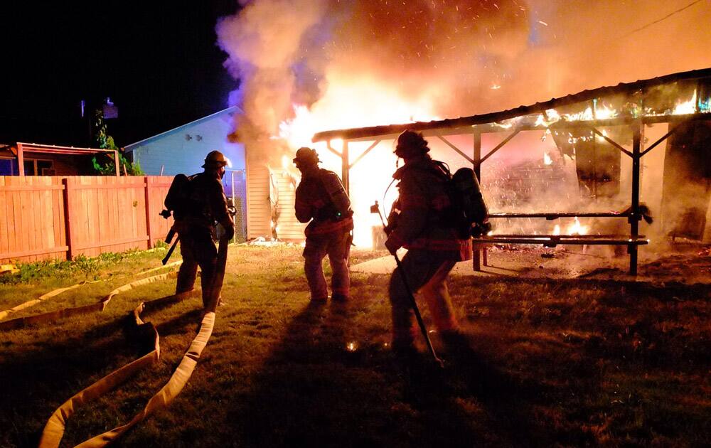 Portland Fire & Rescue, firefighters from Rockwood Fire Station 31 and Gresham Fire battle a house fire in Portland, Ore.