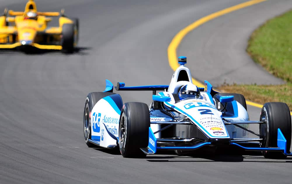 Juan Pablo Montoya, right, leads Ryan Hunter-Reay during an IndyCar 500 auto race practice round at Pocono Raceway in Long Pond.