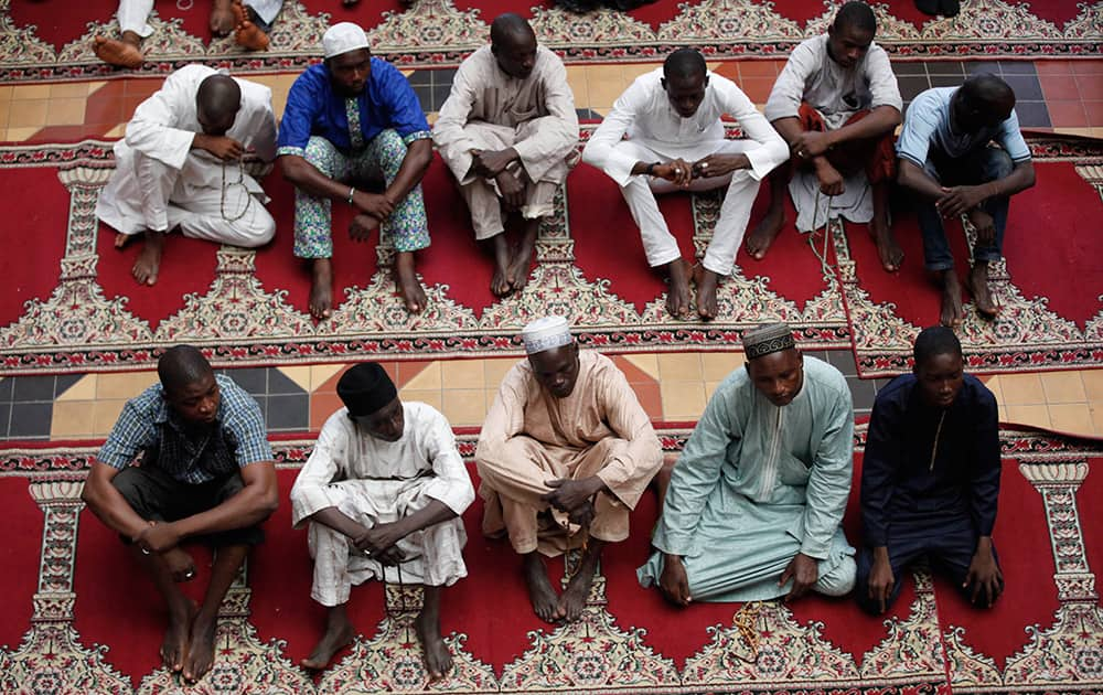 Nigerian Muslims offer prayers on the first Friday of Ramadan at the central Mosque in Lagos, Nigeria.