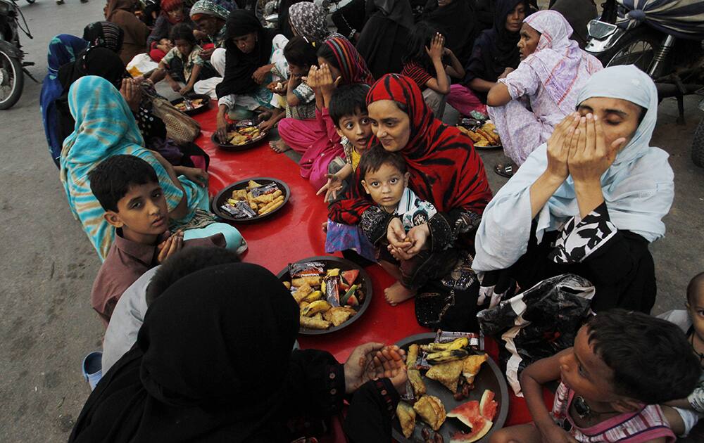 Pakistani Muslims wait to break their fast at sunset in Karachi, Pakistan.