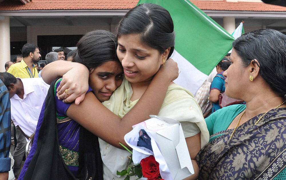 One of the nurses who were stranded in the territory held by Islamic extremists in Iraq, being received by relatives upon arrival at the airport in Kochi.