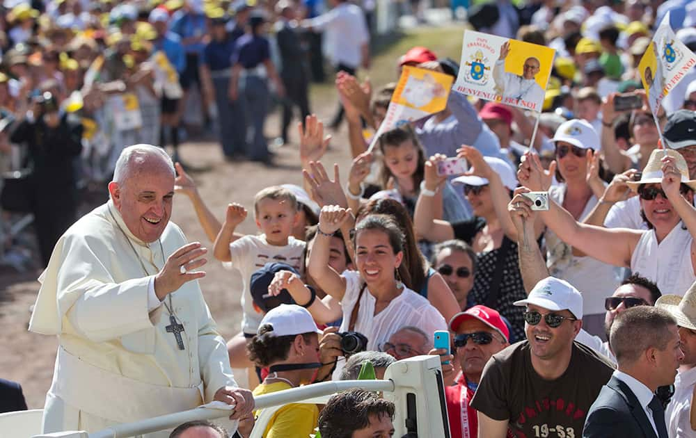 Pope Francis smiles as he arrives to give a mass in Campobasso, Italy.