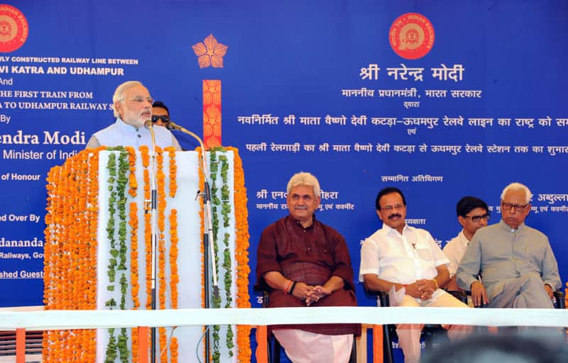 The Prime Minister, Shri Narendra Modi addressing at the dedication ceremony of the newly constructed railway line between Shri Mata Vaishno Devi Katra-Udhampur Section - the first train from Shri Mata Vaishno Devi Katra-Udhampur to the Nation, at Shri Mata Vaishno Devi Katra Railway Station, in Jammu and Kashmir. (Pic Courtesy: PIB)