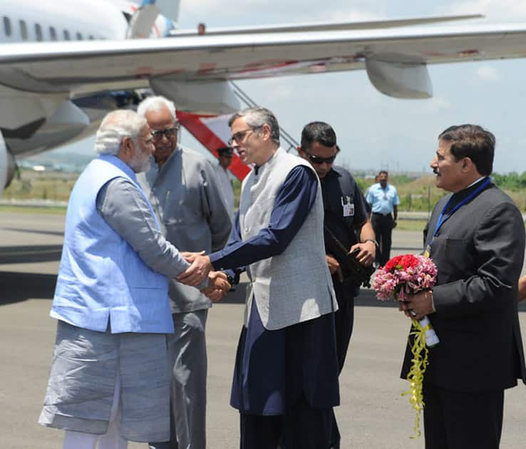 The Prime Minister, Shri Narendra Modi being received by the Chief Minister of Jammu and Kashmir, Shri Omar Abdullah, on his arrival at Srinagar airport, in Jammu and Kashmir. The Governor of Jammu and Kashmir, Shri N.N. Vohra is also seen. (Pic Courtesy: PIB)