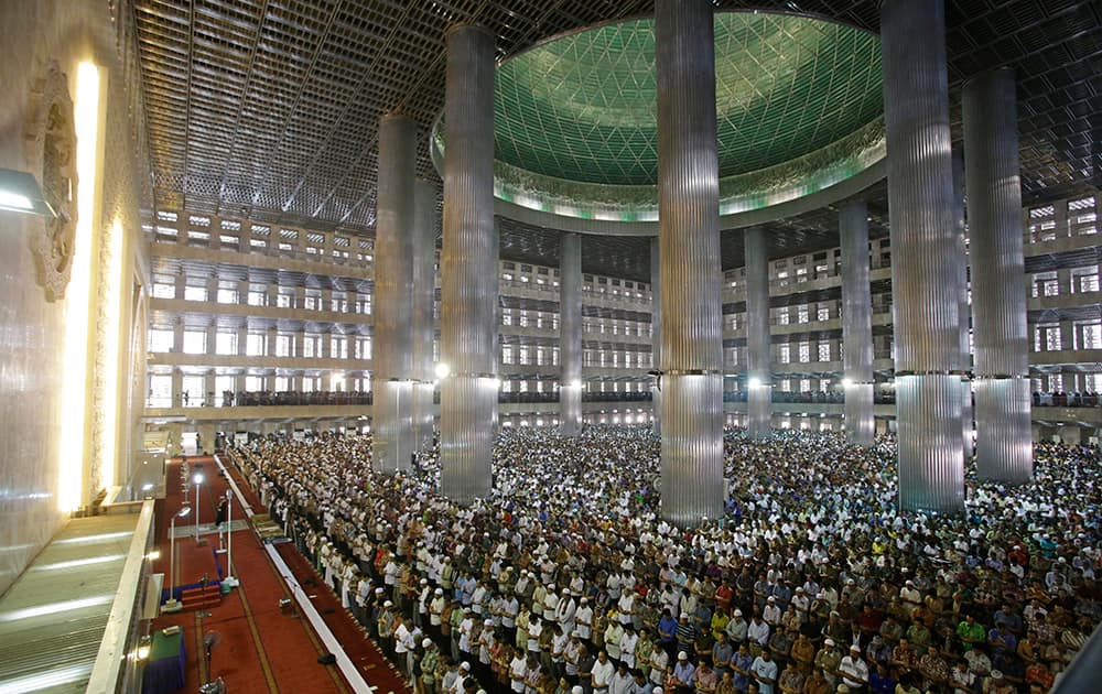 Indonesian Muslims gather and offer Friday prayers during Ramadan at Istiqlal Mosque in Jakarta.