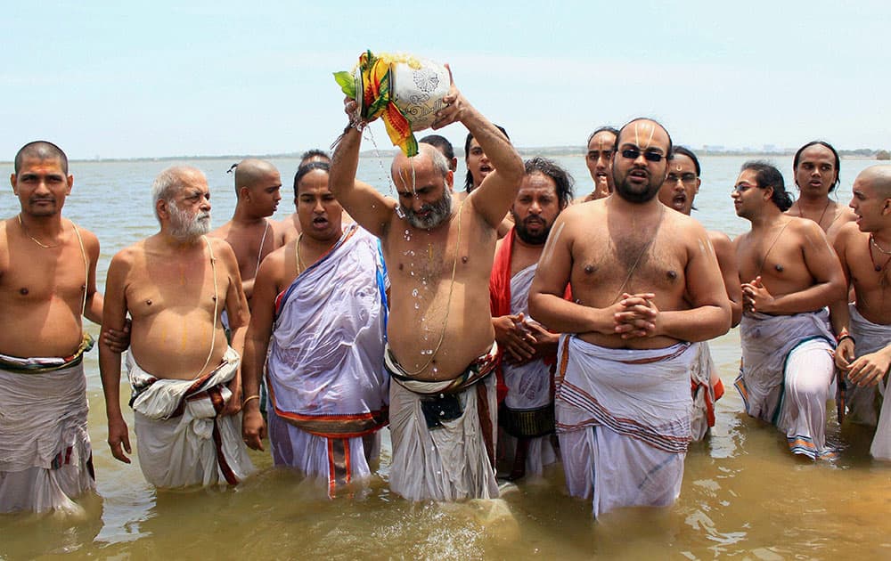 Priests performing Varuna Pooja.