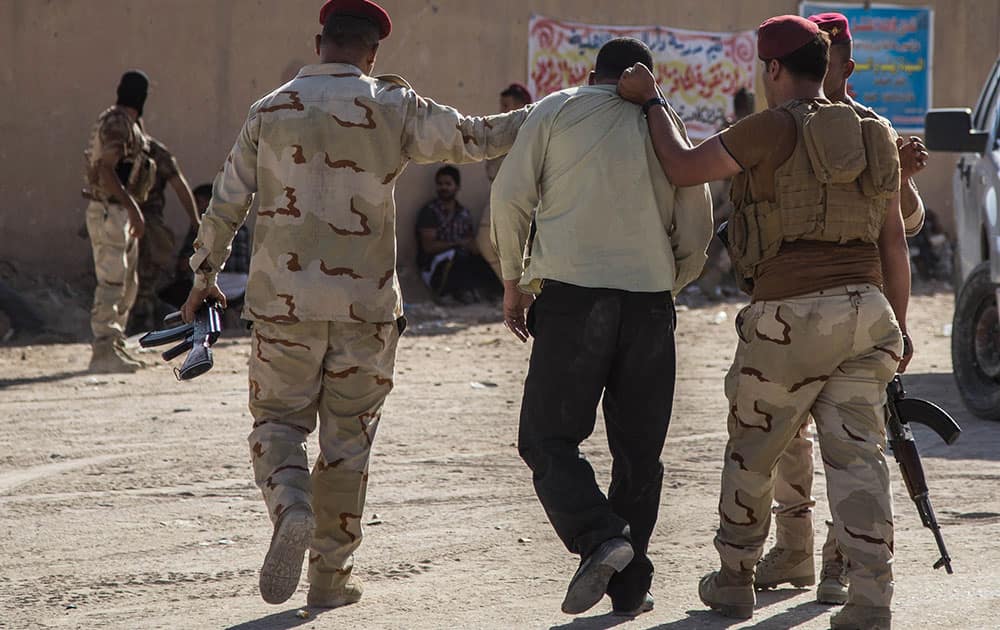 Iraqi security forces arrest followers of Shiite cleric Mahmoud al-Sarkhi after clashes with his followers in the Shiite holy city of Karbala.