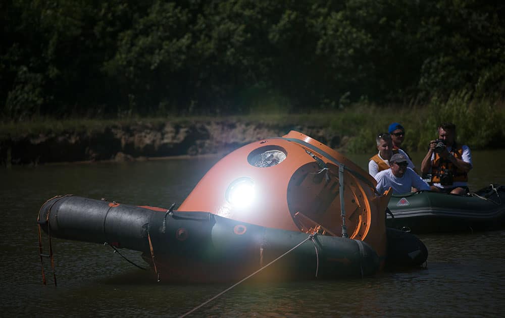 A landing capsule reflects a ray of sunshine during training near Noginsk, 60 km (38 miles) east of Moscow, Russia.