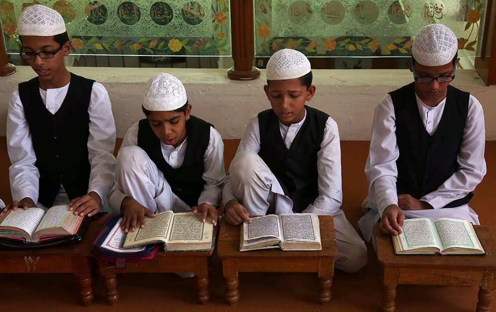 Muslim children read the Quran during the holy month of Ramadan at a madrasa, or religious school, in Hyderabad.