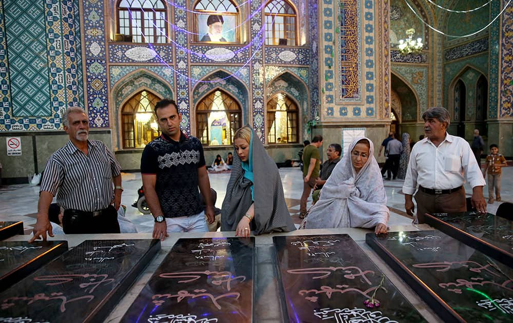 Iranians pray at the shrine of Shiite Saint Saleh during Muslim holy fasting month of Ramadan in northern Tehran, Iran.