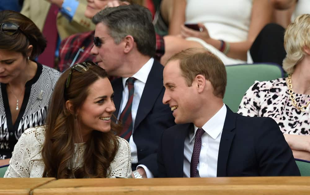 Britain`s Prince William and Kate, Duchess of Cambridge sit in the Royal Box on centre court during the men`s singles quarterfinal match between Andy Murray of Britain and Grigor Dimitrov of Bulgaria at the All England Lawn Tennis Championships in Wimbledon.