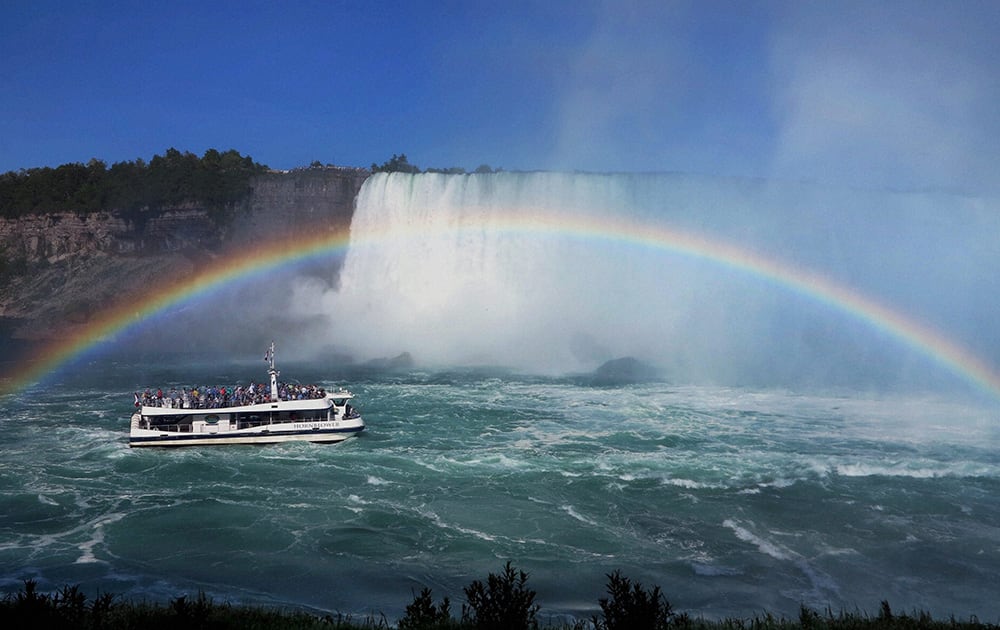 A rainbow adds to the entrancing beauty of Niagara Falls as seen from the Canada side.