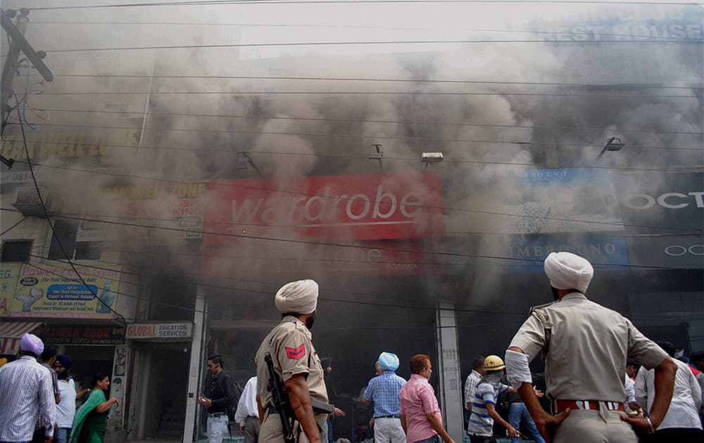 Smoke billowing out of shops where a fire broke out in Amritsar.