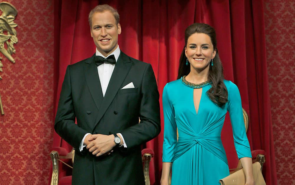 The wax figure of Britain`s Prince William and his wife Kate the Duchess of Cambridge are pictured with their new outfits at Madame Tussauds attraction, in London.