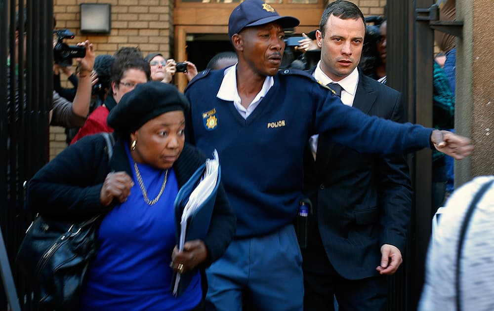 Oscar Pistorius leaves court in Pretoria, South Africa. The murder trial resumed Monday, June 30, 2014 after one month during which mental health experts evaluated the athlete and determined he did not have an anxiety disorder that could have influenced his actions on the night he killed his girlfriend Reeva Steenkamp.