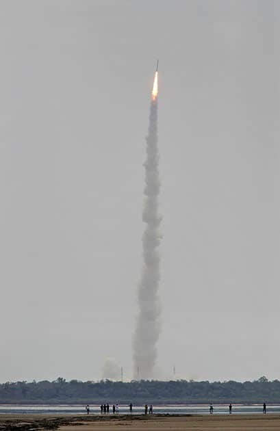 Indians watch the Polar Satellite Launch Vehicle (PSLV-C23) rocket lifting off from the east coast island of Sriharikota.