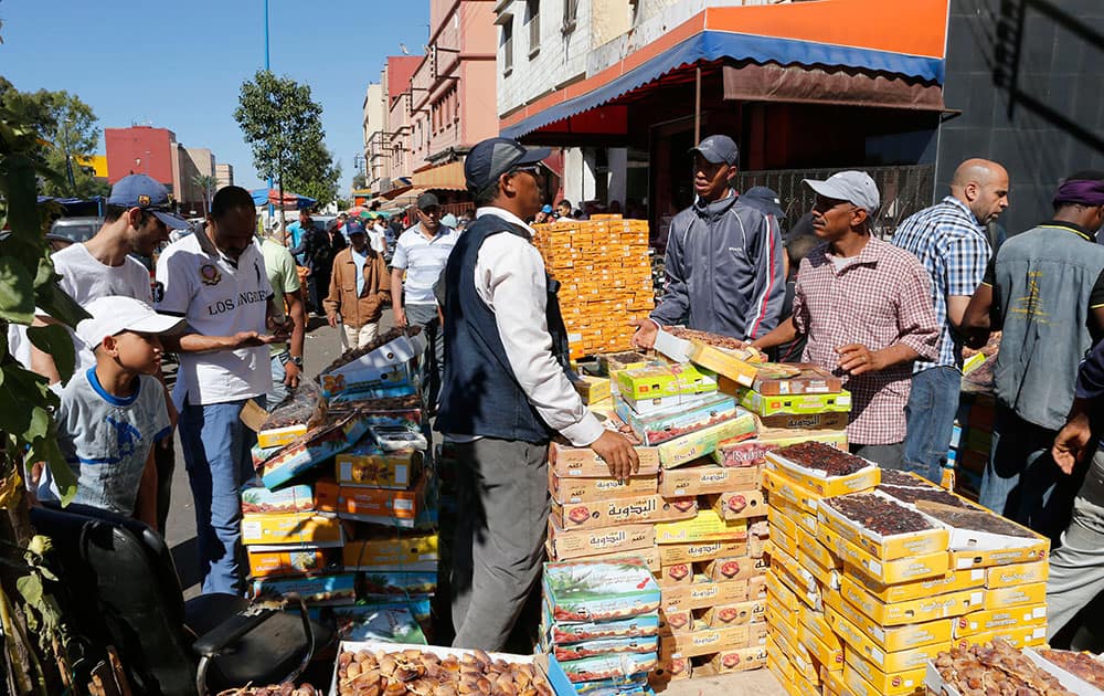 Moroccans buy dried figs and dates to break their fast, at a market in Casablanca, on the first day of the the Islamic holy month of Ramadan. 