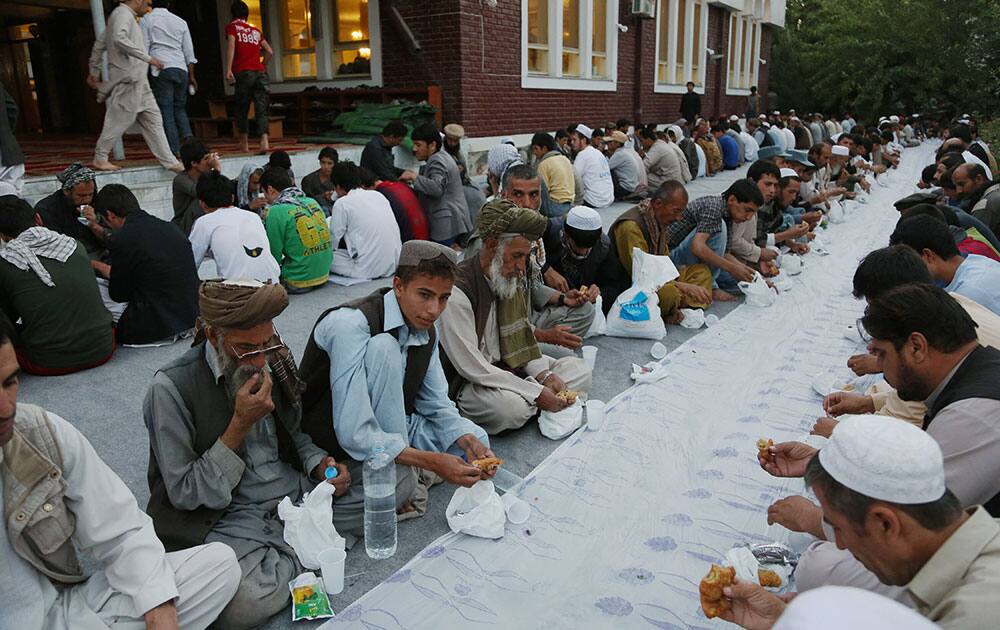 Afghans break their fasting during the Muslim holy month of Ramadan in Kabul, Afghanistan.