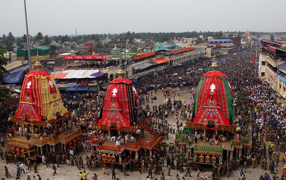 Devotees gather near chariots as they prepare to pull them during the annual Hindu festival ‘Rath Yatra’ or chariot procession in Puri, Orissa state.