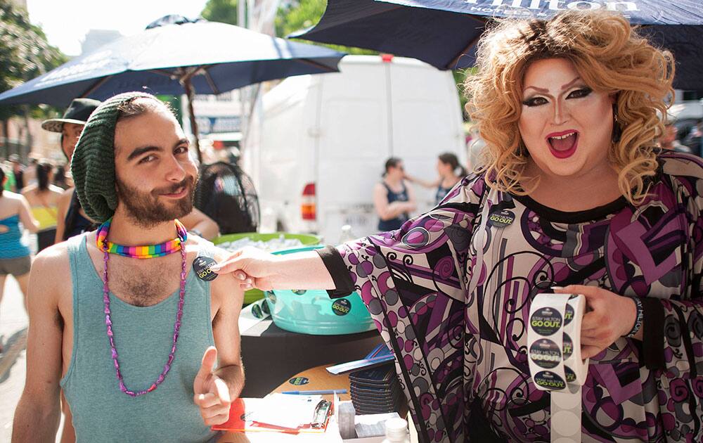 Drag Queen, Ba`Naka, helps festival goers showcase their support of the LGBT community at WorldPride in Toronto, Canada. 