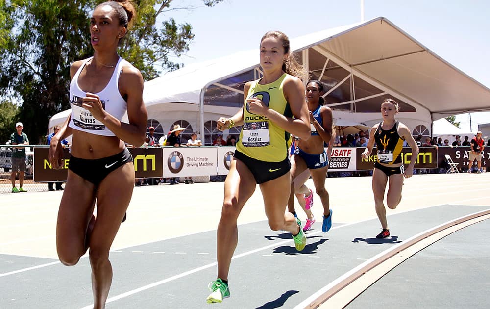 Laura Roesler, second from left, goes into the turn during the women`s 800-meter race at the U.S. outdoor track and field championships, in Sacramento, Calif. 