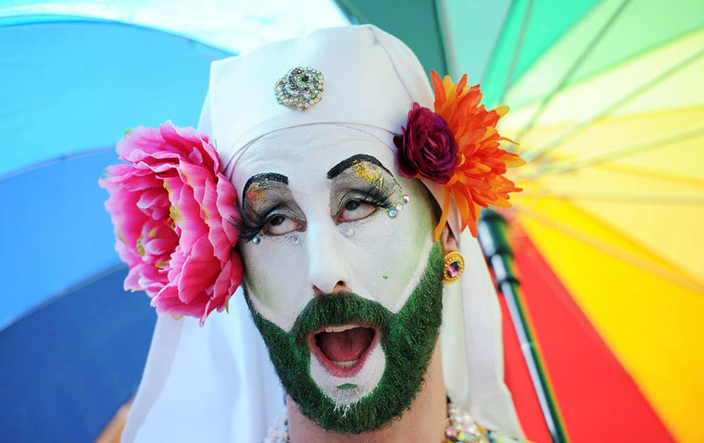 Parade goers celebrate during the WorldPride Parade in Toronto, Ontario. The parade, which is the culmination of WorldPride 2014, attracts over a million people. 