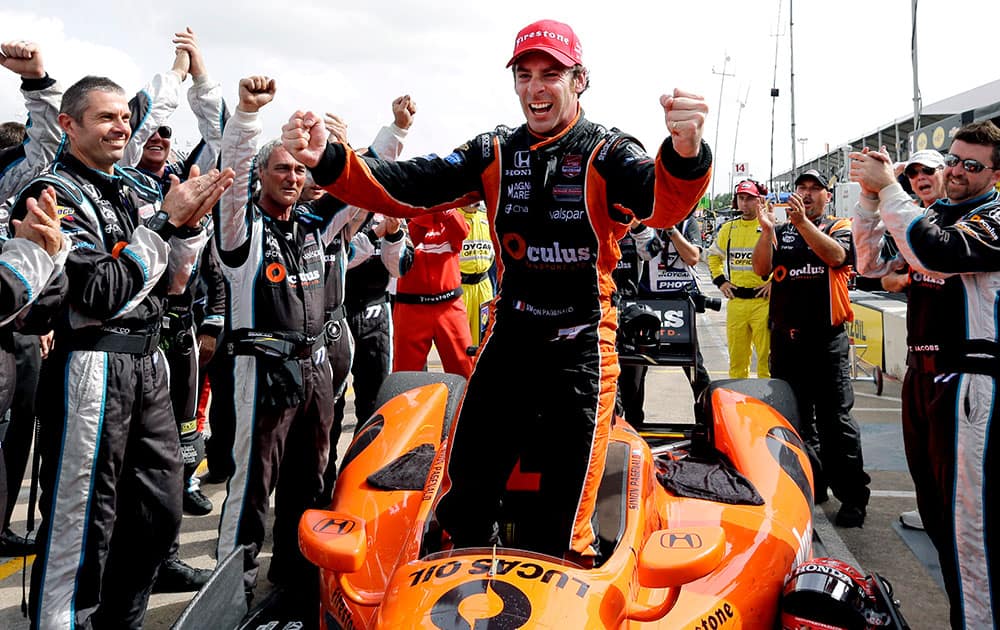 Simon Pagenaud, of France, celebrates after winning the second IndyCar Grand Prix of Houston auto race, in Houston.