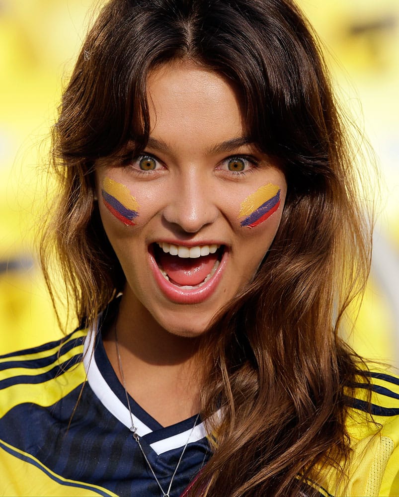 A fan of Colombia cheers prior to the World Cup round of 16 soccer match between Colombia and Uruguay at the Maracana Stadium in Rio de Janeiro, Brazil.