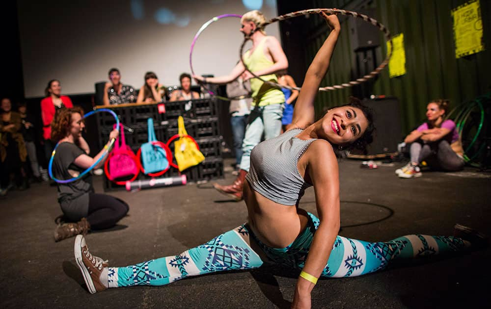 Hoopers perform with their hula hoops during a battle at the Hula Hoop Festival Hoopurbia 2014 in Berlin, Germany.