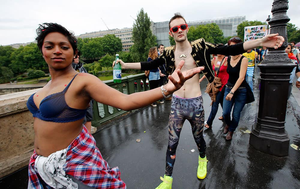 Revelers parade during the annual Gay Pride march in Paris, France.