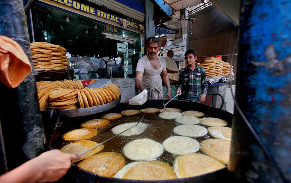 A Pakistani vendor prepares special vermicelli delicacies for the upcoming Islamic holy month of Ramadan in Rawalpindi, Pakistan.