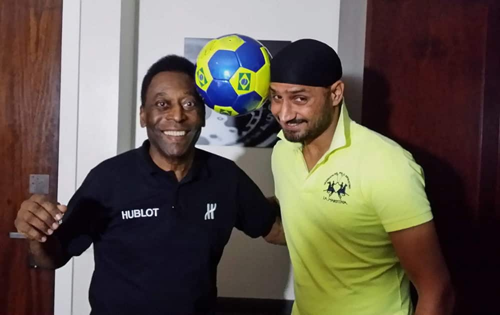 Harbhajan Singh, who is in Brazil to watch the FIFA World Cup, shares a light moment with the legendary Brazilian footballer Pele in Rio de Janeiro.