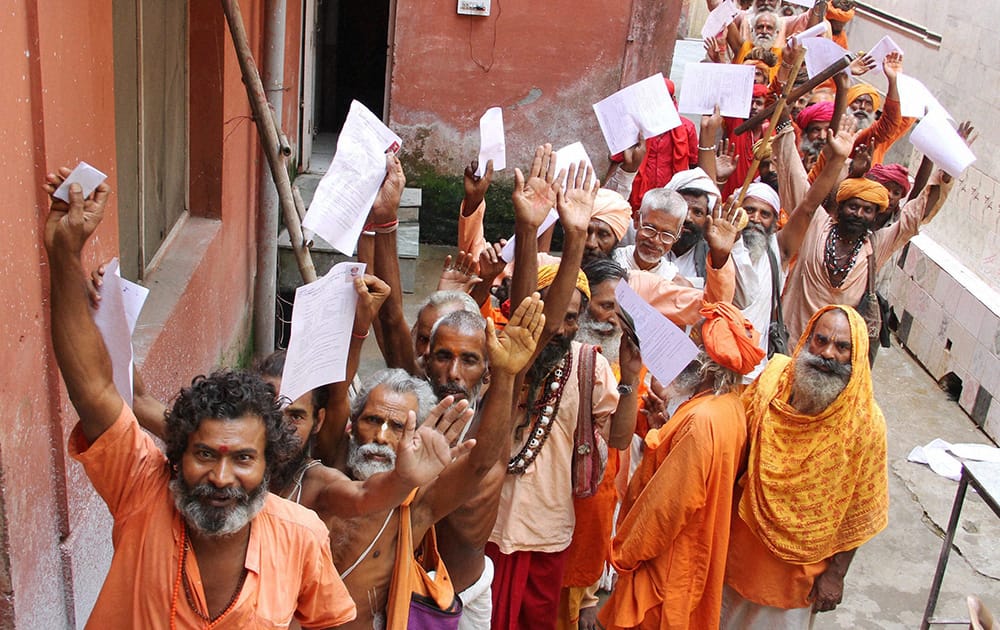 Sadhus stand in a queue to register for the annual pilgrimage to the Amarnath cave shrine at base camp in Jammu.