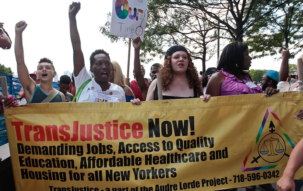 People march during the 10th annual Trans Day of Action in New York. Participants decried violence and discrimination while celebrating strides made by the lesbian, gay, bisexual and transgender communities.