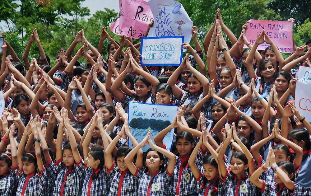 Children pray for the rains at a school in Moradabad.