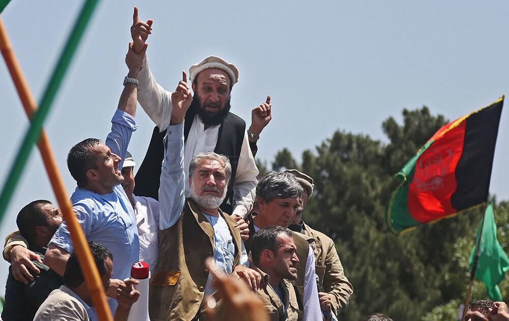 Afghan presidential candidate Abdullah Abdullah attends a protest in Kabul. Afghanistan`s security situation has been complicated by a political crisis stemming from allegations of massive fraud in the recent election to replace President Hamid Karzai, the only leader the country has known since the Taliban regime was ousted nearly 13 years ago.