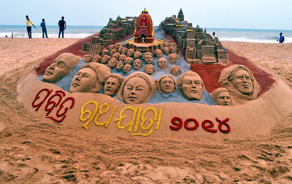 Artists create a sand art on Jagannath Rath Yatra at Puri beach, Odisha.