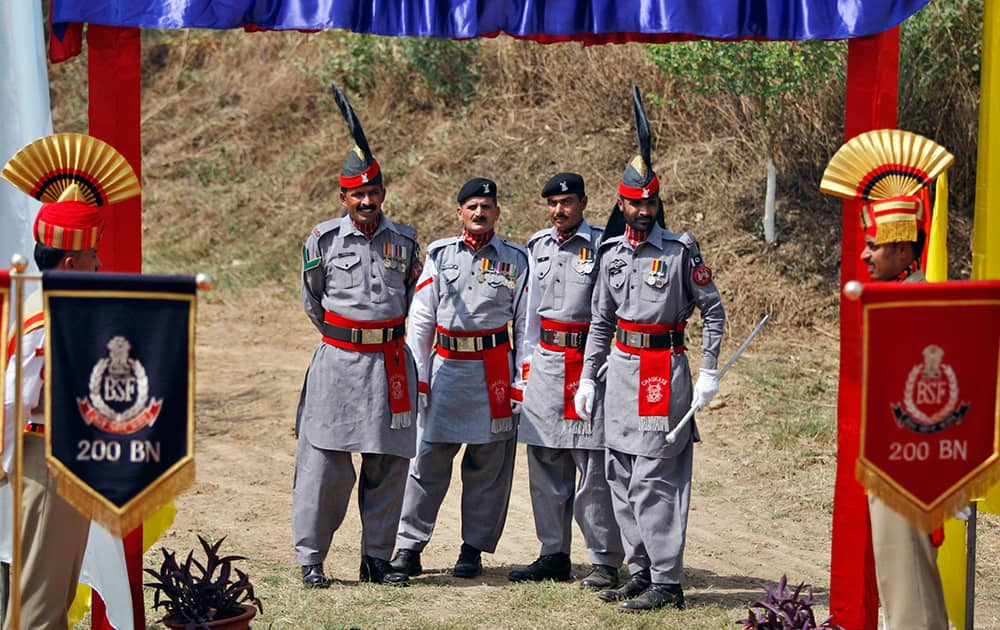 Pakistani rangers stand guard during the annual Chamliyal fair at Chamliyal post, about 47 kilometers south of Jammu. The over 300-year old festival is celebrated on the fourth Thursday every June at two spots, one at Chamliyal in the Indian territory and the other at Saidanwali in Pakistan in honor of the saint.