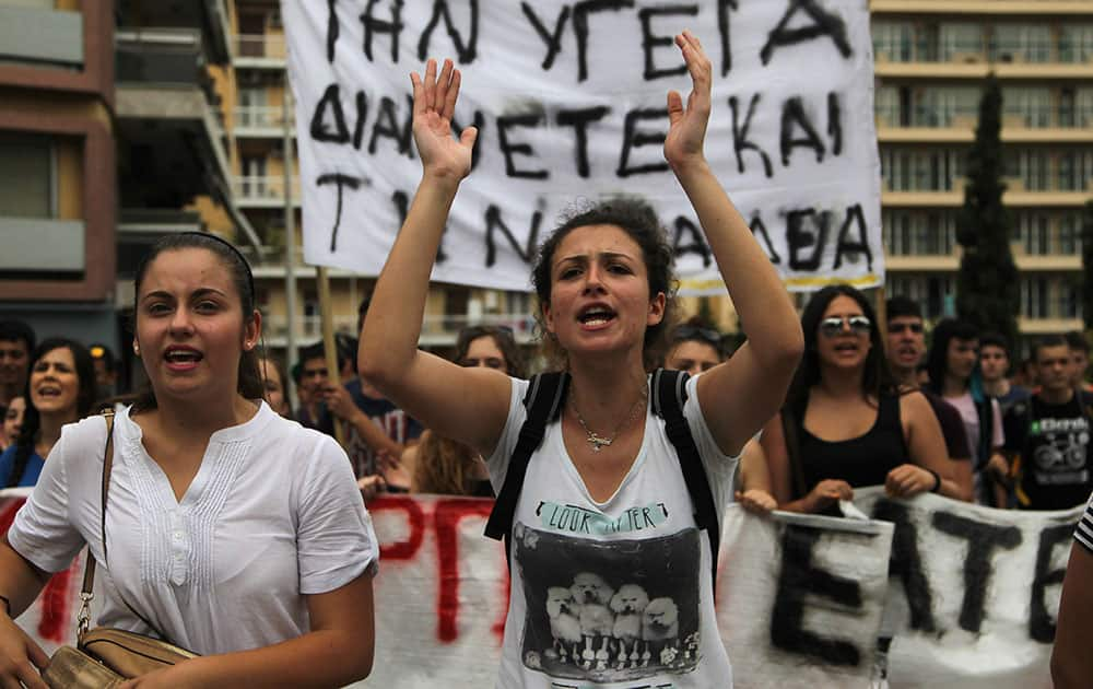 Students shout slogans outside of the ministry of Macedonia-Thrace, during a protest in the northern Greek port city of Thessaloniki.