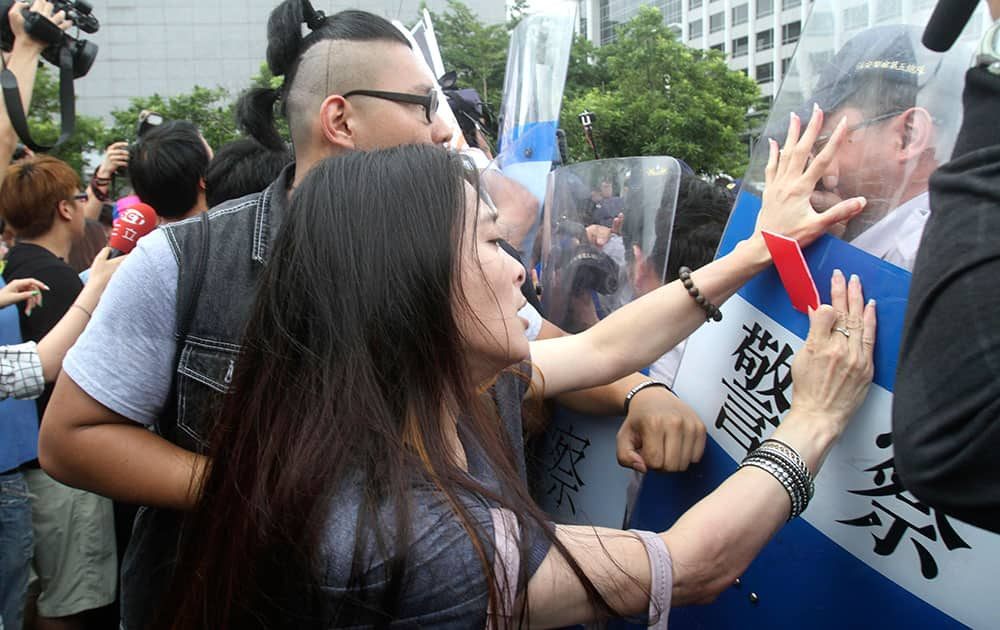 Student demonstrators scuffle with police as Zhang Zhijun, minister of Beijing’s Taiwan Affairs Office, meets with his Taiwan counterpart Wang Yu-chi at the airport hotel in Taoyuan, Taiwan.