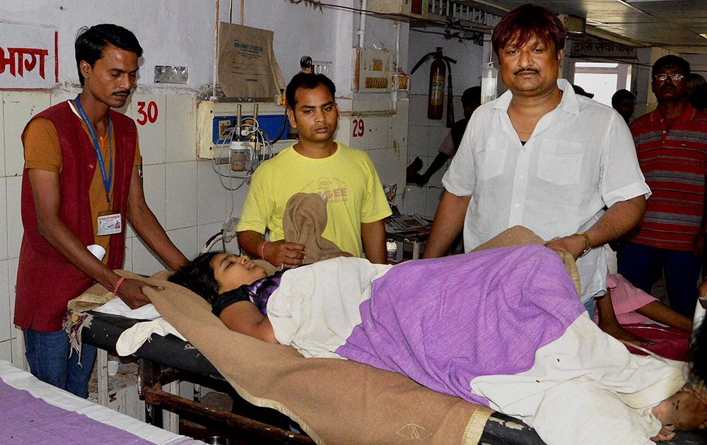 An injured of the derailed Delhi-Dibrugarh Rajdhani Express at Patna Medical College and Hospital (PMCH) for treatment in Patna.