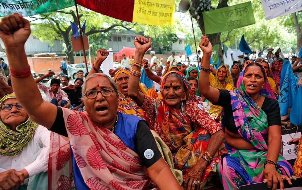 Activists of save Narmada river movement shout slogans during a protest in New Delhi.