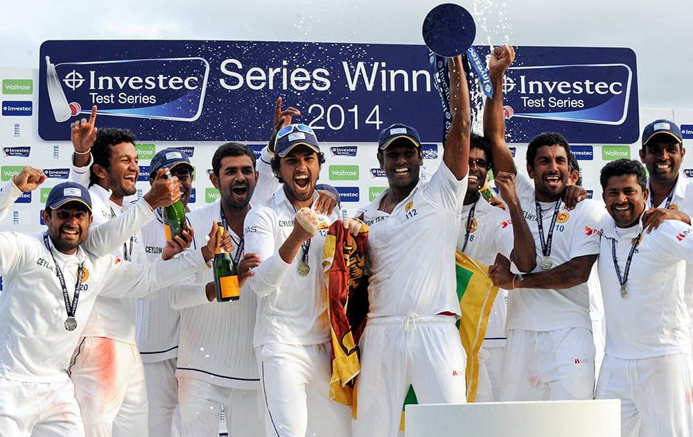 Sri Lanka players celebrate with the trophy after beating England by 100 runs to win the series during day five of the Second Test Match between England and Sri Lanka at Headingley cricket ground, Leeds, England.